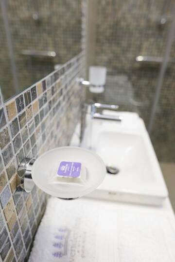 Фото номера Двухместный номер с 1 кроватью, вид на сад Гостевой дом Lavender Inn Guest House г. Viešvėnai 2