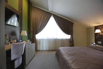 Фото номера Двухместный номер Делюкс с 1 кроватью Гостевой дом Lavender Inn Guest House г. Viešvėnai 4